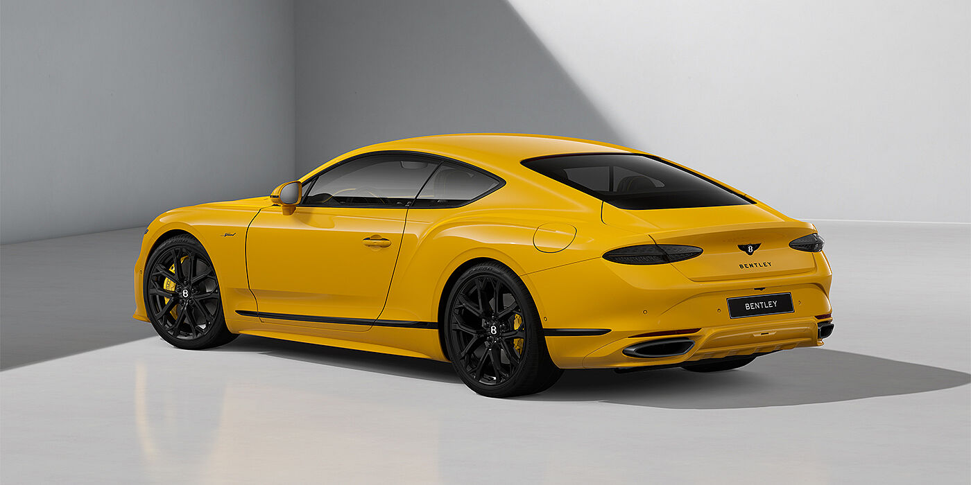 Gohm Sportwagen GmbH | Bentley Stuttgart Bentley Continental GT Speed coupe in Monaco Yellow paint and 22" Ten spoke sport wheels - rear 3/4