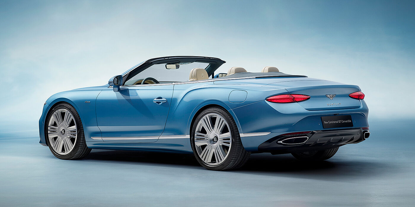 Gohm Sportwagen GmbH | Bentley Stuttgart New Bentley Continental GTC Azure convertible rear view in Light Windsor blue paint with 22 inch ten spoke wheels and chrome exterior details