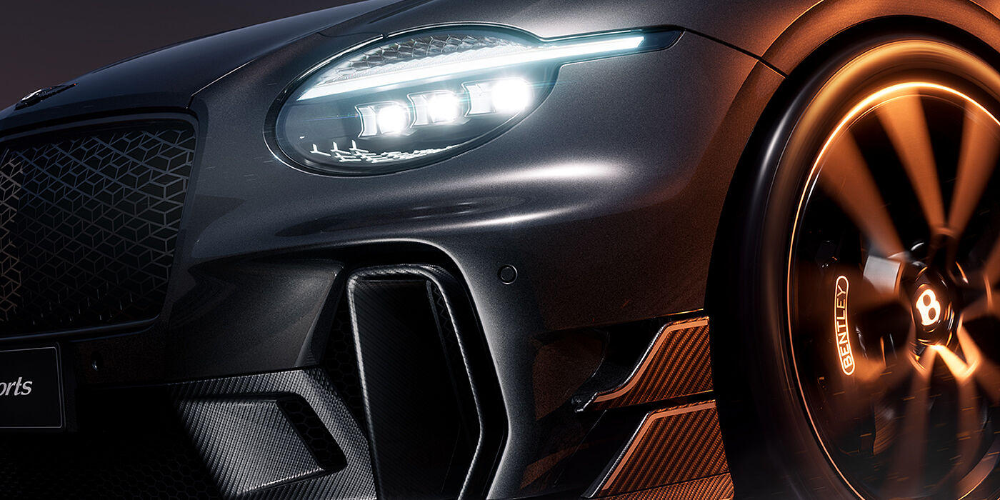 Gohm Sportwagen GmbH | Bentley Stuttgart Bentley Supersports front three quarter headlamp and lower grille detail in "Nightfall" design theme with Anthracite paint, Camel accents and Camel and Beluga Black striping