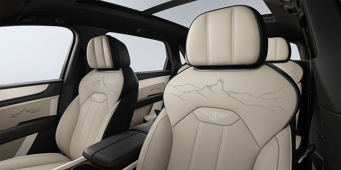 Gohm Sportwagen GmbH | Bentley Stuttgart Bentayga EWB Artenara Edition SUV front seats in Portand and Beluga Black hides and Artenara stitch detail