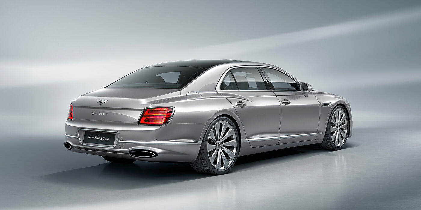 Gohm Sportwagen GmbH | Bentley Stuttgart New Bentley Flying Spur sedan rear view in Silverlake paint with ten spoke wheels and chrome matrix grille