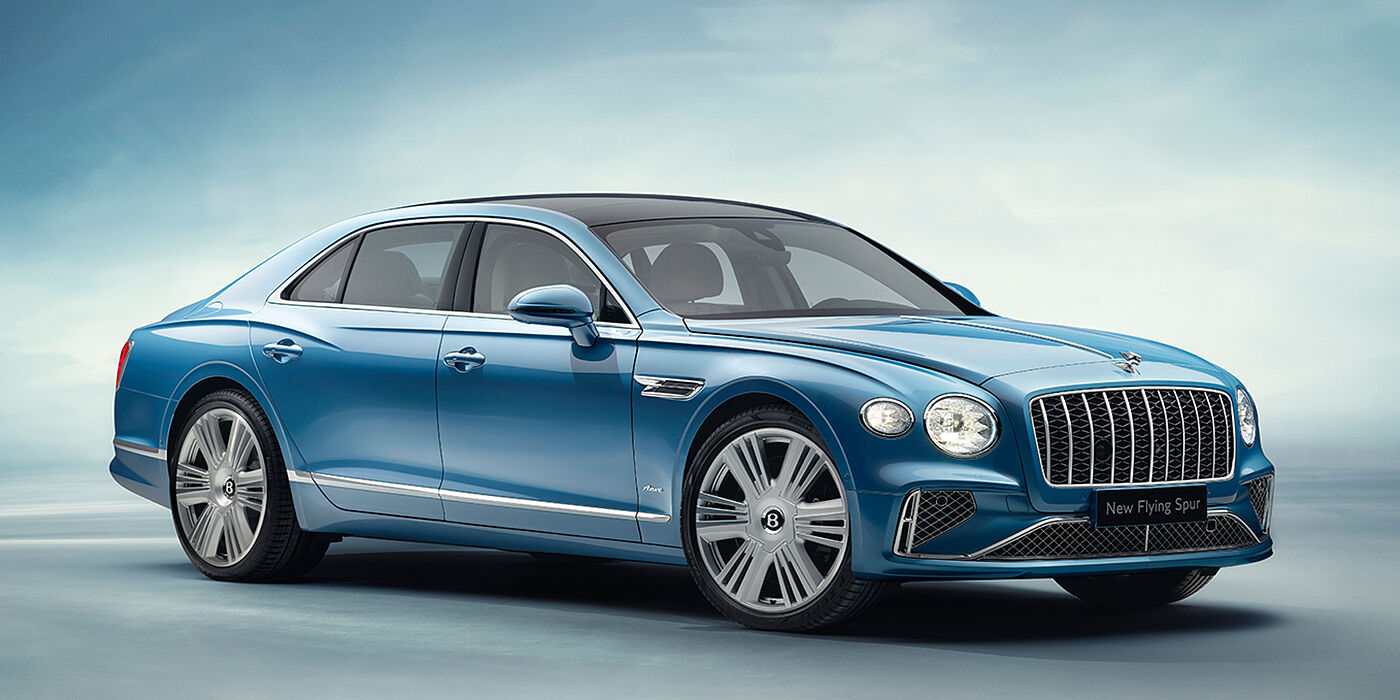Gohm Sportwagen GmbH | Bentley Stuttgart New Bentley Flying Spur Azure sedan front view in Light windsor blue by Mulliner paint with 22 inch Azure wheels and chrome exterior details