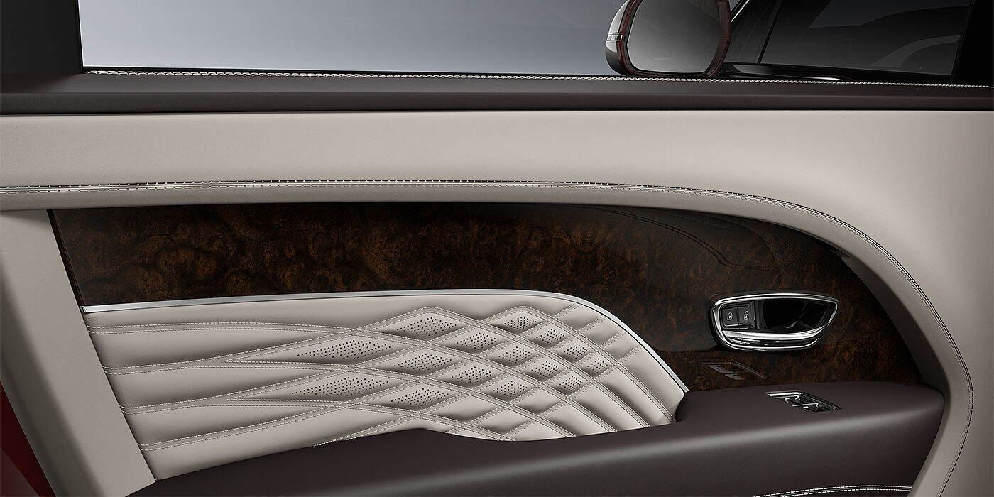 Gohm Sportwagen GmbH | Bentley Stuttgart Bentley Bentayga EWB Azure SUV door interior detail in Linen and Burnt Oak hides with Dark Stained Burr Walnut veneer