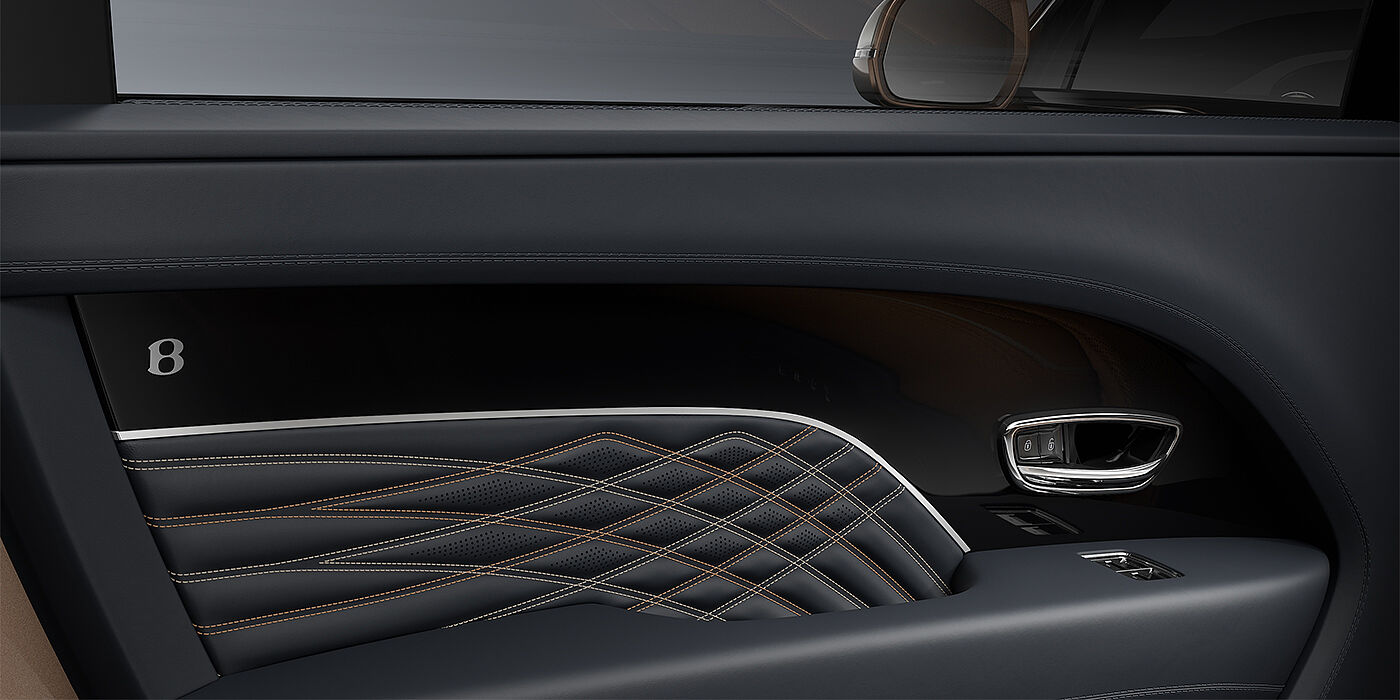 Gohm Sportwagen GmbH | Bentley Stuttgart Bentley Bentayga EWB Mulliner SUV door interior detail in Brunel hide and Grand Black veneer with Mulliner contrast stitching