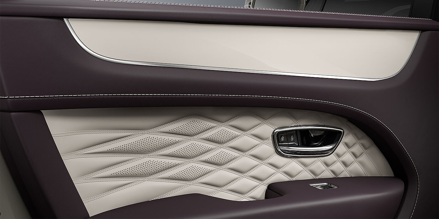 Gohm Sportwagen GmbH | Bentley Stuttgart Bentley Bentayga EWB Azure SUV door interior detail in Linen and Damson hides with Piano Linen veneer