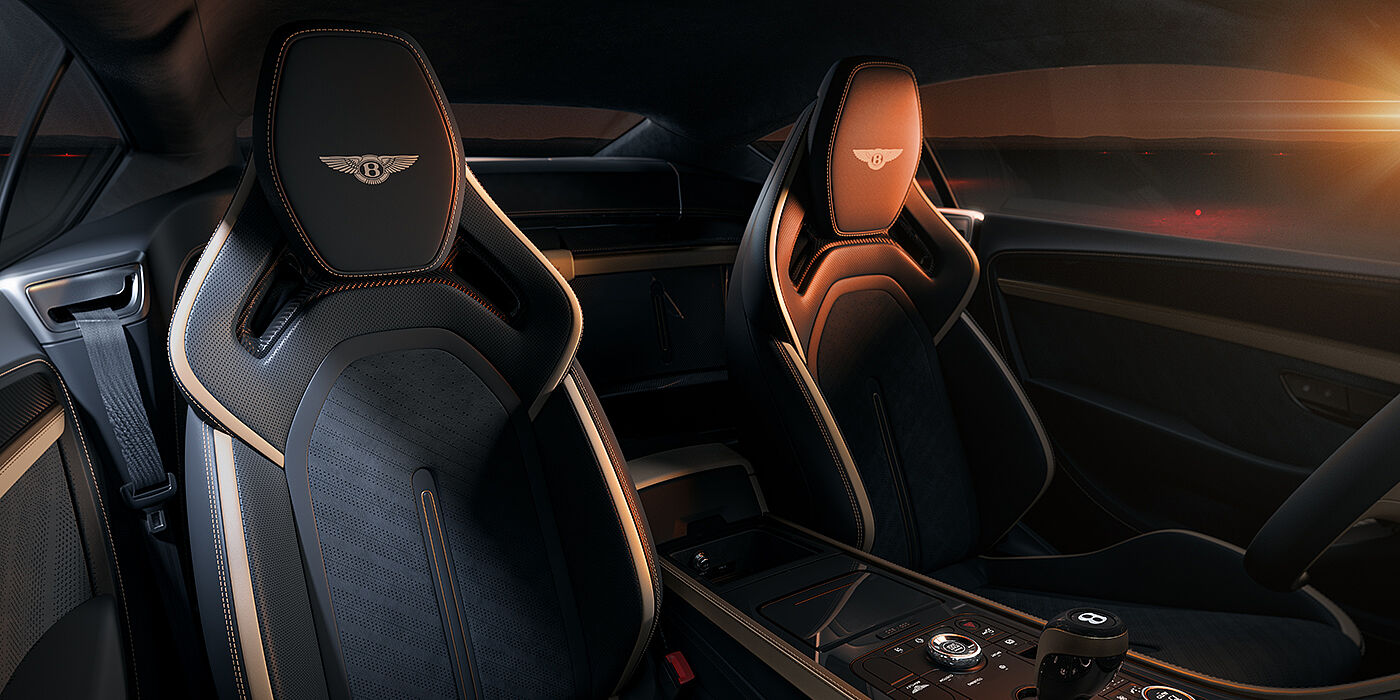 Gohm Sportwagen GmbH | Bentley Stuttgart Bentley Supersports rear interior with Supersports seats in Camel and Beluga black hides hide and high gloss carbon fibre veneer