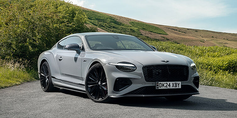 Gohm Sportwagen GmbH | Bentley Stuttgart Bentley Continental GT front three quarter with Carbon Fibre Specification parked on road.