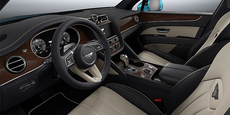 Gohm Sportwagen GmbH | Bentley Stuttgart Bentley Bentayga EWB SUV front interior in Portland and Imperial Blue hides with Crown Cut Walnut veneer