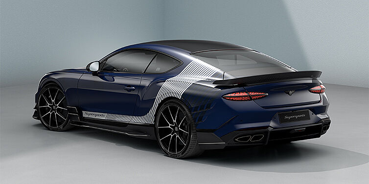 Gohm Sportwagen GmbH | Bentley Stuttgart Bentley Supersports rear three quarter in "Skies" Design theme with Electric Blue paint finish and Arctica white and Oxford blue paint stripes across the rear haunch.