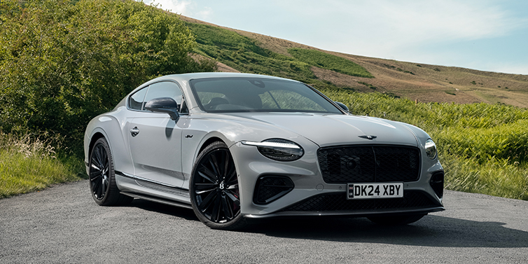Gohm Sportwagen GmbH | Bentley Stuttgart Bentley Continental GT front three quarter with Carbon Fibre Specification parked on road.