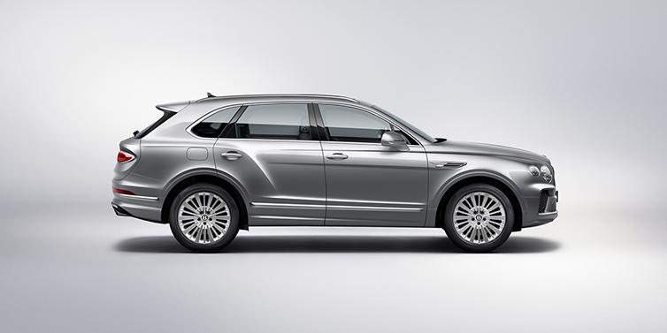 Gohm Sportwagen GmbH | Bentley Stuttgart Bentley Bentayga SUV side profile in Moonbeam silver paint against white background featuring 21 inch 5 spoke wheels