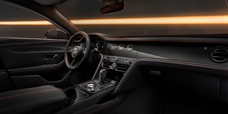 Gohm Sportwagen GmbH | Bentley Stuttgart Bentley Flying Spur Black Edition sedan front interior in Beluga black hide with High Gloss Carbon Fibre veneer