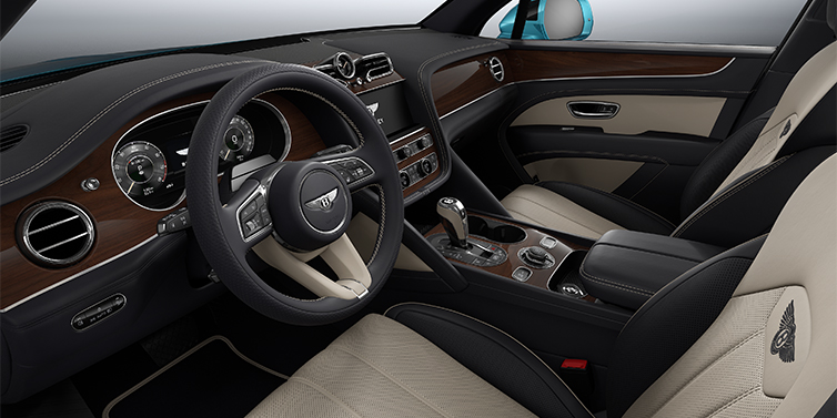 Gohm Sportwagen GmbH | Bentley Stuttgart Bentley Bentayga EWB SUV front interior in Portland and Imperial Blue hides with Crown Cut Walnut veneer