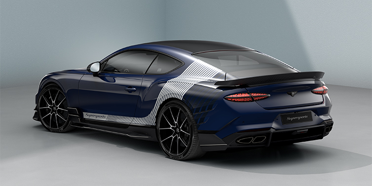Gohm Sportwagen GmbH | Bentley Stuttgart Bentley Supersports rear three quarter in "Skies" Design theme with Electric Blue paint finish and Arctica white and Oxford blue paint stripes across the rear haunch.