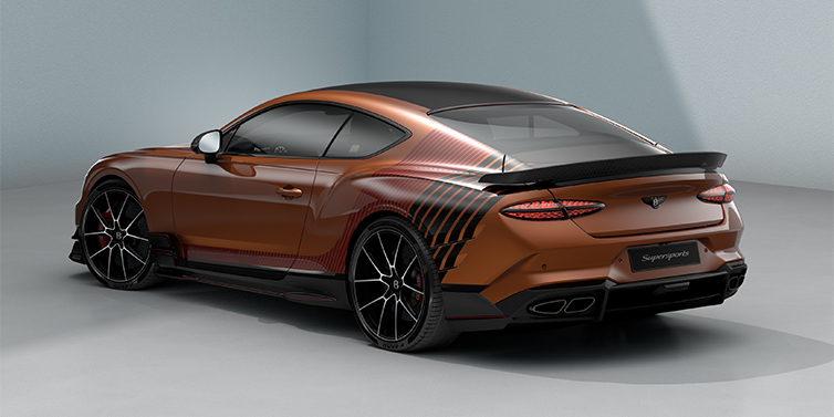 Gohm Sportwagen GmbH | Bentley Stuttgart Bentley Supersports rear three quarter in "Meteorite" Design theme with Orange Flame paint and Beluga Black and Candy Red paint stripes across the rear haunch.