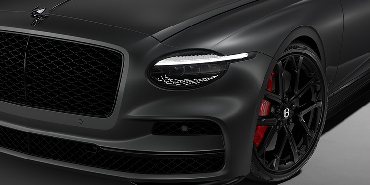Gohm Sportwagen GmbH | Bentley Stuttgart New Bentley Flying Spur S sedan head lamp against Anthracite Satin paint with  22" Sports wheel