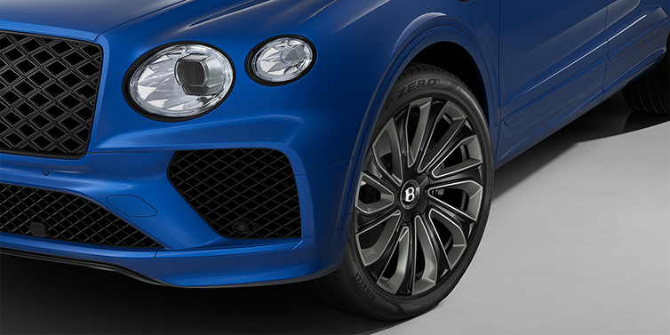 Gohm Sportwagen GmbH | Bentley Stuttgart Bentley Bentayga Artenara Edition SUV front detail in Sequin Blue paint and 22" Mulliner Gloss Black wheels front 3/4