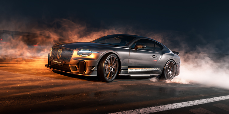 Gohm Sportwagen GmbH | Bentley Stuttgart Bentley Supersports front three quarter in "Nightfall" Design theme with Anthracite paint, Camel accents and Camel and Beluga black striping standing on mist covered concrete