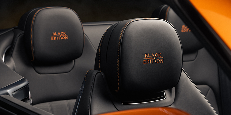 Gohm Sportwagen GmbH | Bentley Stuttgart Bentley Continental GTC Black Edition convertible seat detail with Beluga black hide and Mandarin emblem stitching