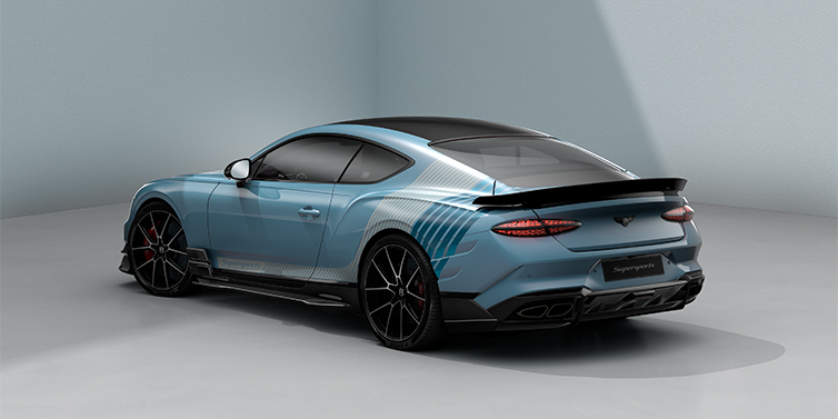 Gohm Sportwagen GmbH | Bentley Stuttgart Bentley Supersports rear three quarter in "Daybreak" Design theme with Jetstream blue paint and Arctica white and Portofino blue paint stripes across the rear haunch.