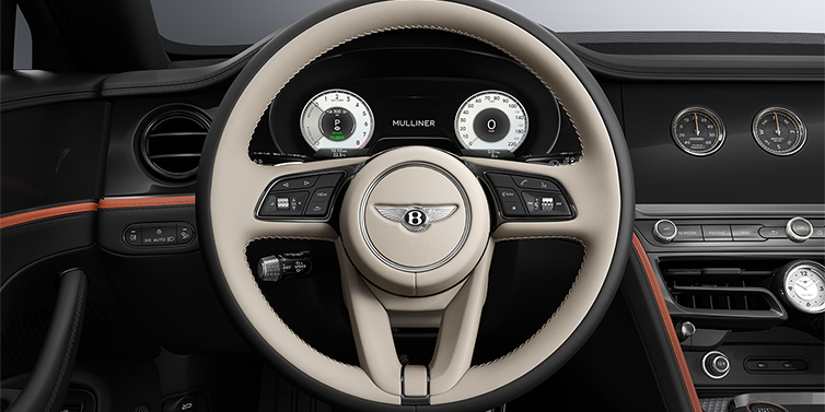Gohm Sportwagen GmbH | Bentley Stuttgart New Bentley Flying Spur Mulliner sedan steering wheel and dash in Portland and Beluga Black hides and Grand Black veneer