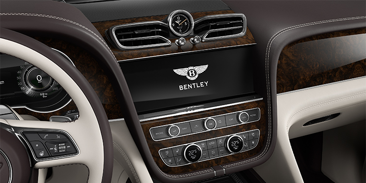 Gohm Sportwagen GmbH | Bentley Stuttgart Bentley Bentayga EWB Azure SUV centre console detail showing Bentley Wings