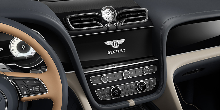 Gohm Sportwagen GmbH | Bentley Stuttgart Bentley Bentayga EWB Mulliner SUV centre console detail showing Bentley Wings